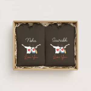 Gift box with two personalized couple hoodies featuring custom names and romantic heart artwork, ideal for gifting.