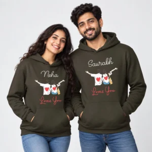 Personalized name couple hoodies in olive green with Neha and Saurabh names, a couple illustration, red hearts, and Loves You text.