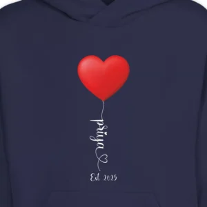 Close-up of personalized name hoodie from couple set featuring red heart balloon design and custom printed name with Est. 2025 text