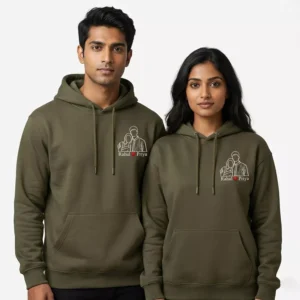 Couple wearing personalized hoodies with custom photo-to-line-art embroidery and names on the chest