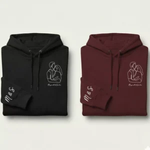 Premium sleeve initials couple hoodie set in black and maroon with minimal line-art couple design and custom initials