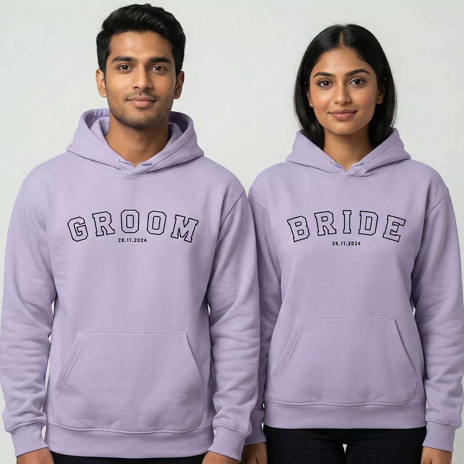 Bride and Groom wearing matching lavender hoodies with custom printed wedding date