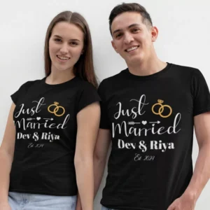 Couple wearing custom Just Married wedding T shirts with names and wedding date printed in white and gold design