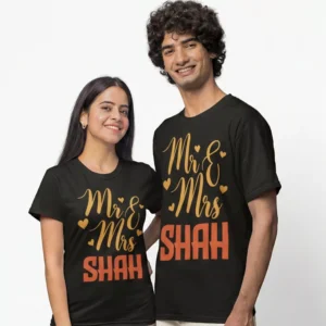 Newly married couple wearing personalized Mr and Mrs surname matching black T-shirts for wedding gift