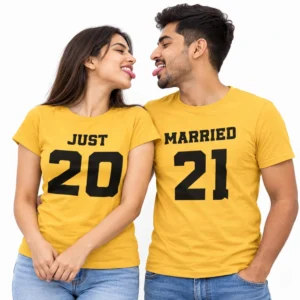 Playful Indian couple wearing matching yellow T-shirts with bold black JUST 20 lettering on the woman's shirt and MARRIED 21 lettering on the man's shirt.