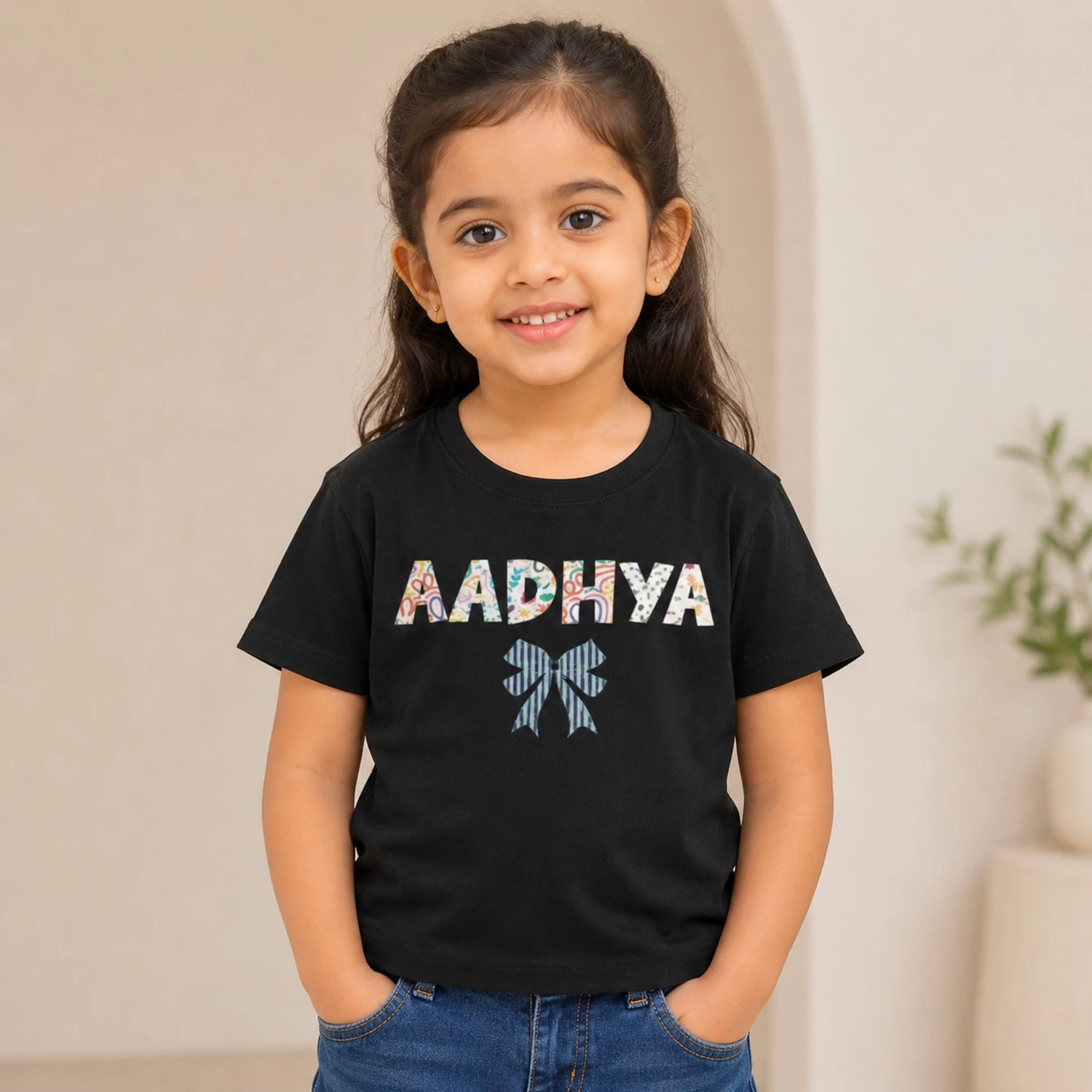 Personalised Aadhya girls black T-shirt with patterned custom name and decorative bow design
