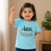 Personalised Aditi girls light blue T-shirt with delicate floral garden and custom name