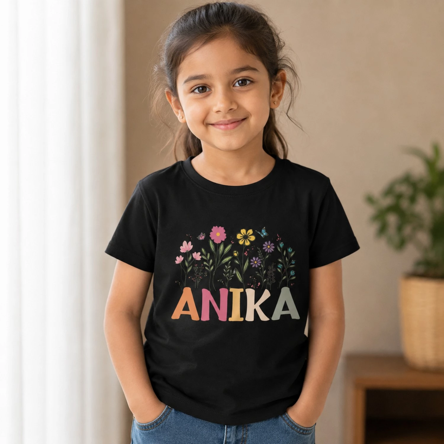 Personalised Anika girls black T-shirt with colourful flowers and custom name print
