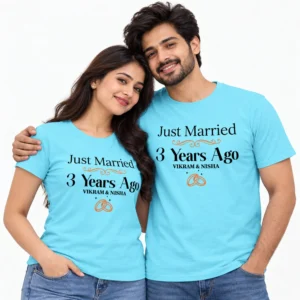 Indian couple in sky blue anniversary T-shirts reading Just Married 3 Years Ago with Vikram & Nisha names and orange wedding rings.