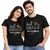 Indian couple wearing black personalized Just Married T-shirts with white script, gold wedding rings, Dev & Riya names, and Est. 2024.