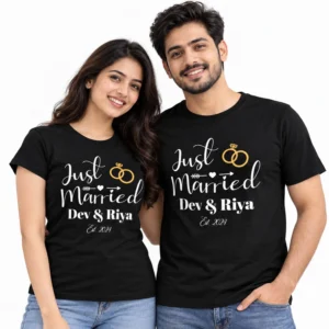 Indian couple wearing black personalized Just Married T-shirts with white script, gold wedding rings, Dev & Riya names, and Est. 2024.