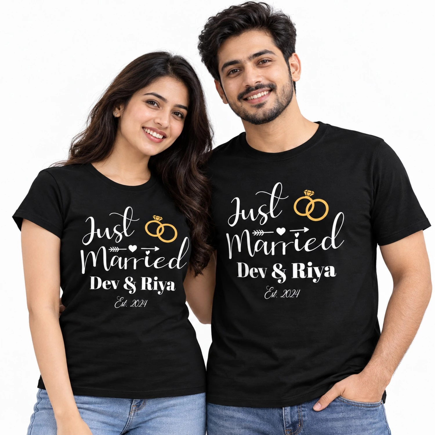 Indian couple wearing black personalized Just Married T-shirts with white script, gold wedding rings, Dev & Riya names, and Est. 2024.