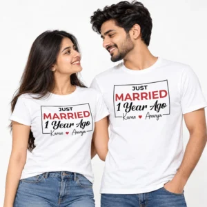 Couple wearing matching white Just Married 1 Year Ago anniversary T-shirts with bold red MARRIED lettering, black script and Karan and Ananya names.