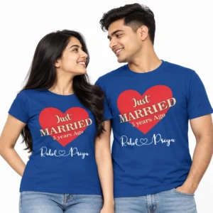 Indian couple wearing matching blue personalized anniversary T-shirts featuring a large red heart, Just Married 5 Years Ago lettering, and Rahul and Priya names in white script.
