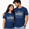 Newly married couple wearing matching navy blue personalized Just Married T-shirts with custom year and text design.