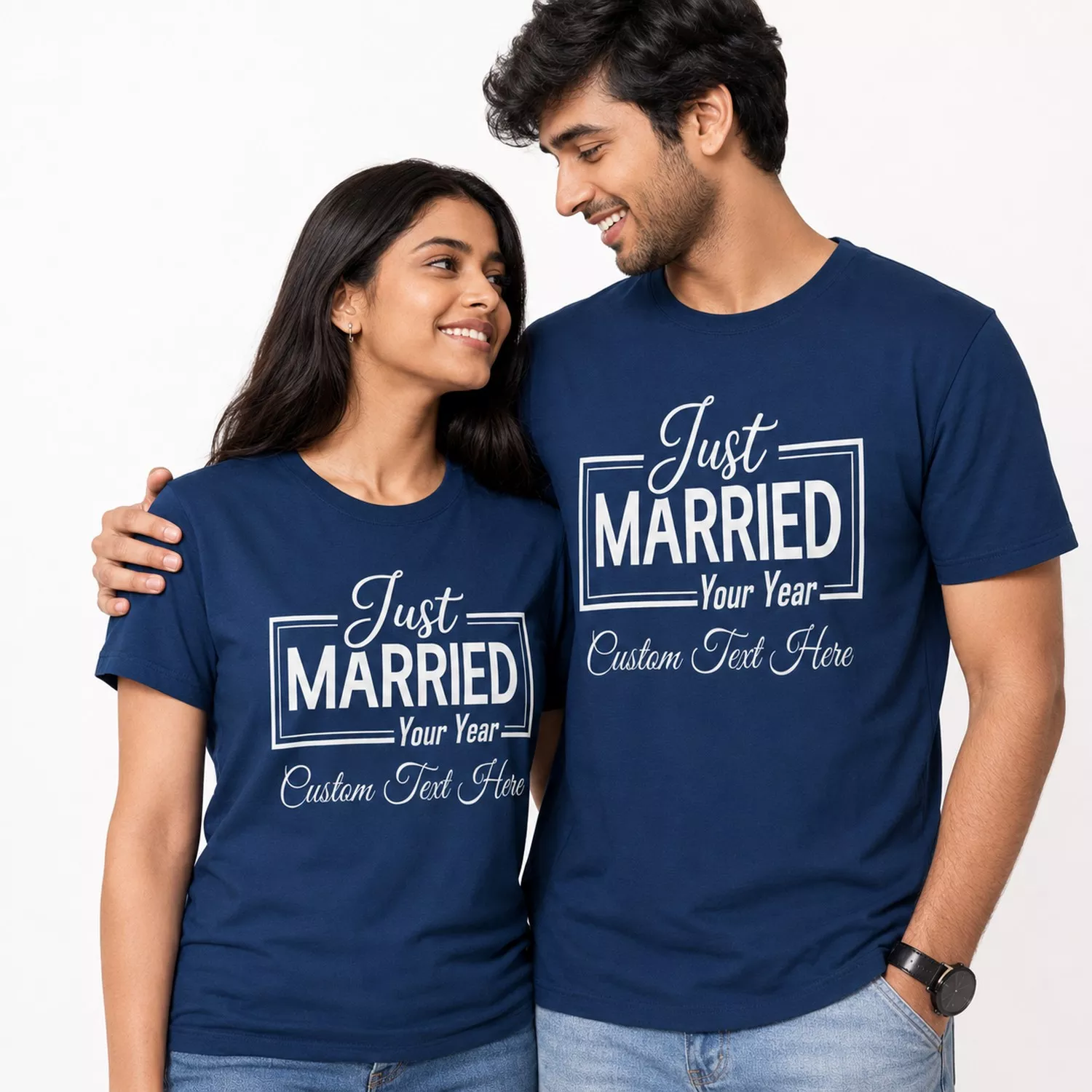 Newly married couple wearing matching navy blue personalized Just Married T-shirts with custom year and text design.