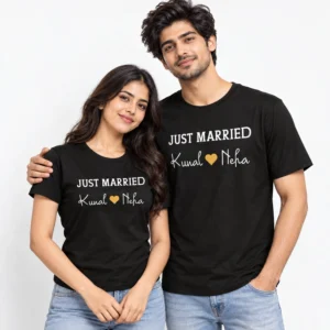 Indian couple wearing matching black Just Married T-shirts with white uppercase lettering, Kunal and Neha names and a golden heart symbol.