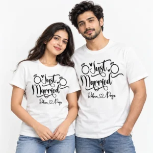 Couple wearing matching white Just Married T-shirts featuring black calligraphy, wedding ring illustrations, hearts and personalized Rohan and Pooja names.