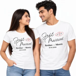 Indian couple wearing matching white personalized Just Married T-shirts featuring black cursive lettering, red intertwined hearts, Keshav and Meera names, and wedding date 20-01-2026.