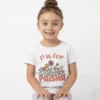 Girl wearing personalized kids name T shirt with custom printed name on soft cotton fabric in India