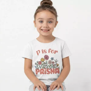 Girl wearing personalized kids name T shirt with custom printed name on soft cotton fabric in India