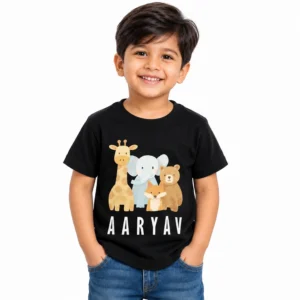 Smiling young boy wearing a black personalized kids T-shirt featuring cute giraffe, elephant, fox and bear illustrations with the name AARYAV in bold white letters.