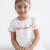 Girl wearing personalized kids name cotton T-shirt with custom name print in India