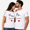 Couple wearing matching personalized Mr and Mrs white T-shirts with surname, established year, and heart design for a wedding gift.