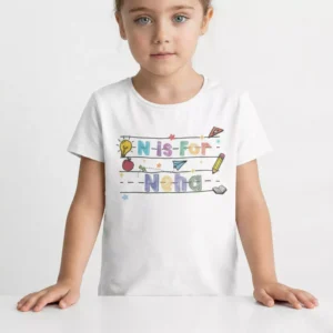 Child wearing personalized N Is For name cotton T-shirt with colorful school themed print