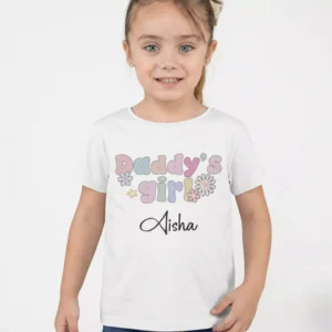 Child wearing personalized cotton birthday T shirt with custom name print and pastel floral design