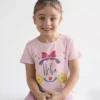 Child wearing pink personalized name cotton T shirt with bow design and custom name print