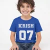 Child wearing blue personalized cotton T shirt with custom name and number print