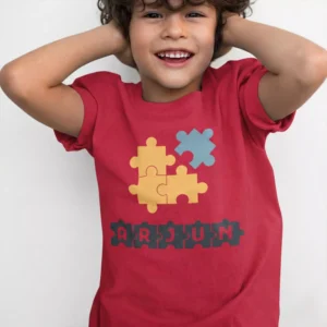Red cotton kids T shirt with colorful puzzle design and custom name print