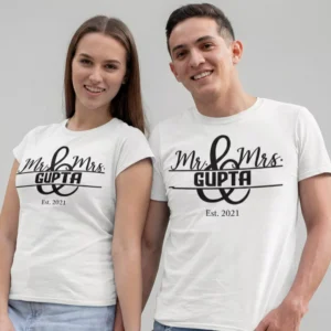 Couple wearing personalized Mr and Mrs matching T-shirts with surname and wedding year printed in minimal design