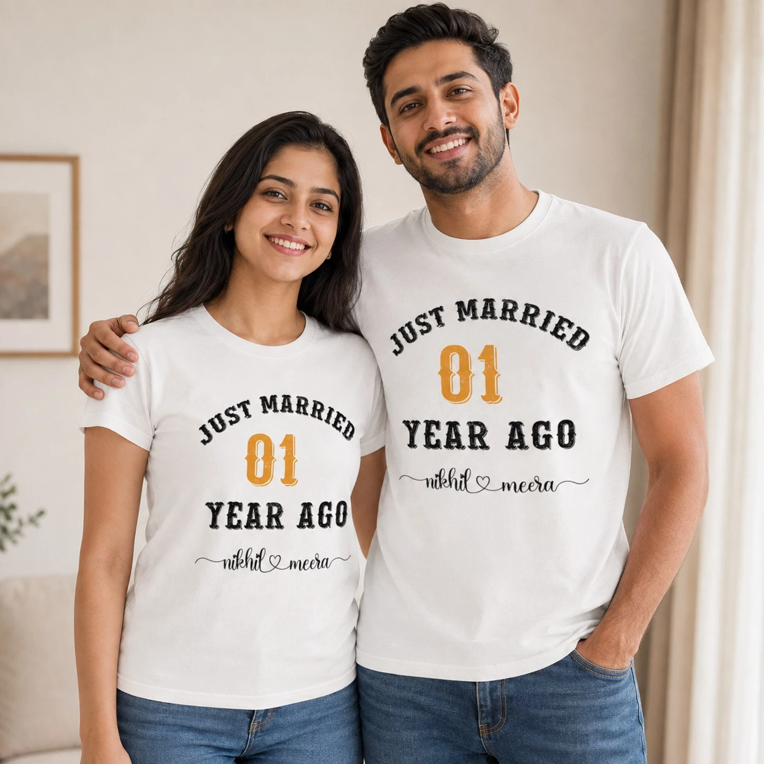 Custom white 1st wedding anniversary couple T-shirts with Just Married 01 Year Ago print and personalised couple names.