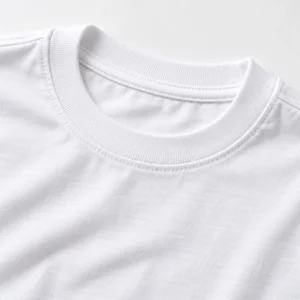 Close-up of a white kids cotton T-shirt showing the ribbed crew neckline, shoulder stitching, smooth fabric surface, and natural cotton texture.