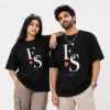 Couple wearing matching black oversized T-shirts with personalised E and S initials, heart and established year