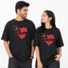Couple wearing black personalised oversized unisex T-shirts with red heart design and custom Raj and Simran names