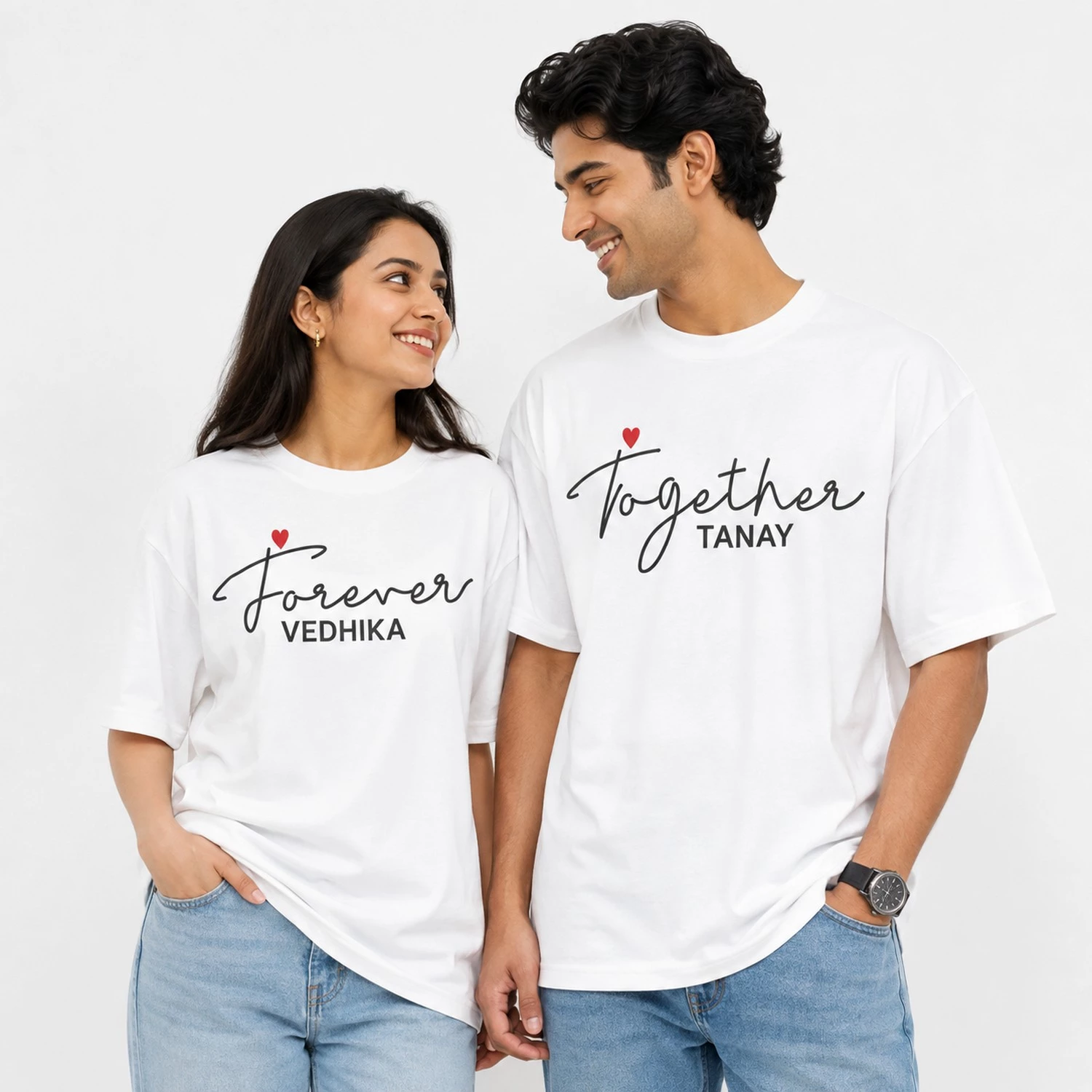 Couple wearing white oversized T-shirts personalised with Forever and Together text, names Vedhika and Tanay