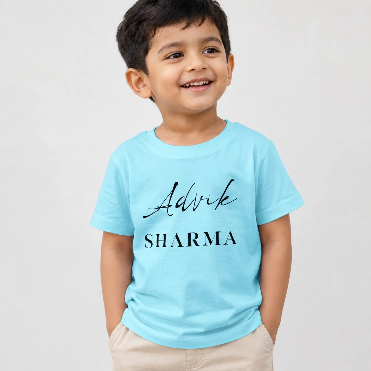 Personalised sky blue boys T-shirt printed with Advik Sharma name