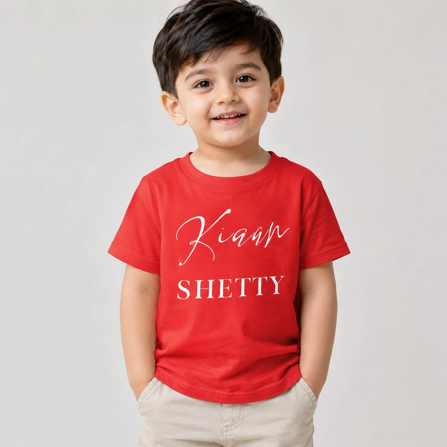 Personalised red boys T-shirt with Kiaan Shetty custom name print