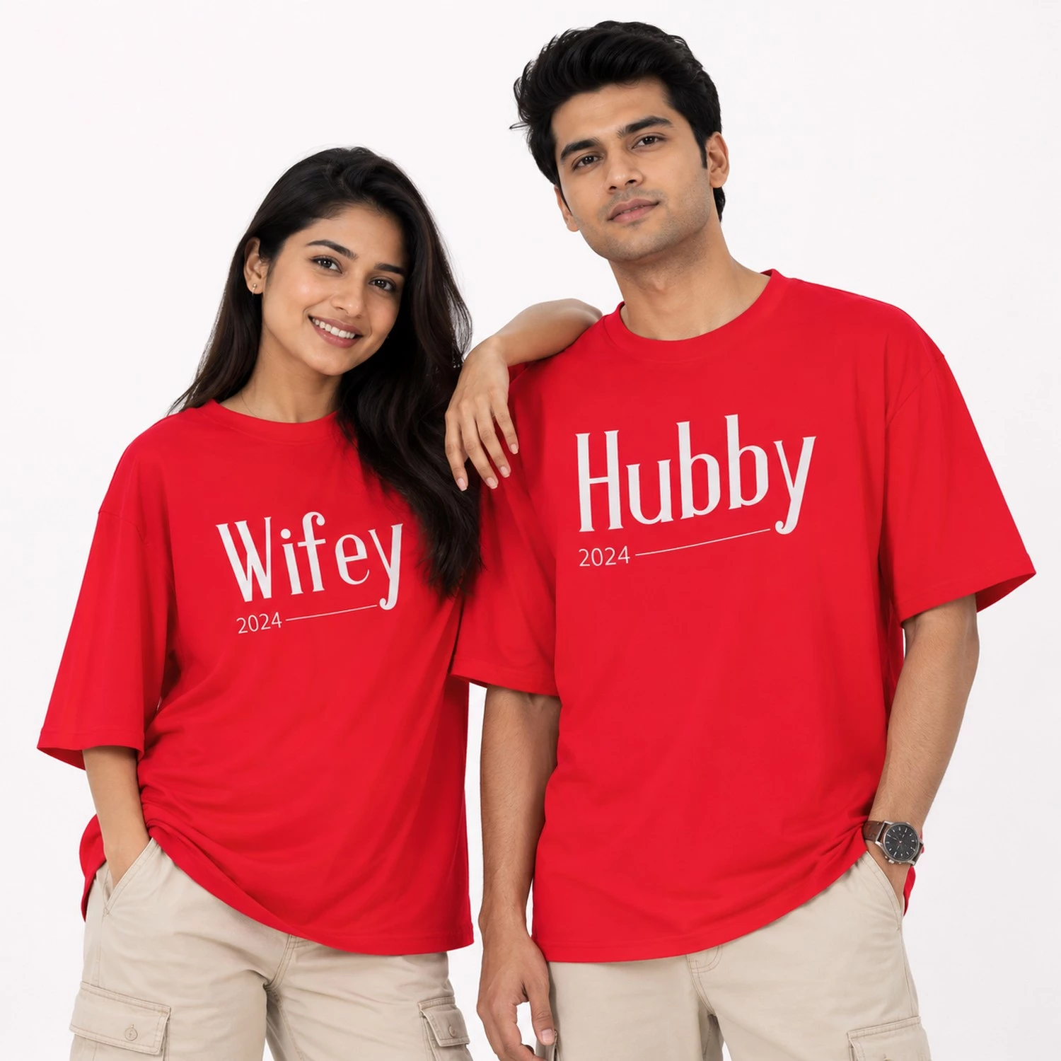 Couple wearing red oversized T-shirts with personalised Hubby and Wifey text and 2024 year design