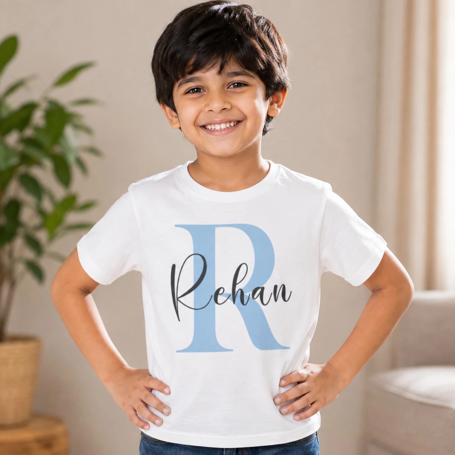 Personalised white boys T-shirt with Rehan name and large blue R initial