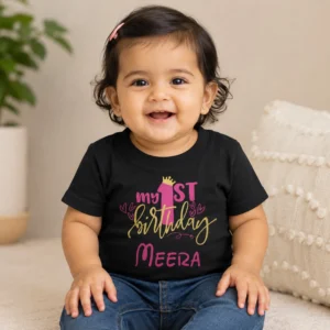 Personalised black first birthday T-shirt for baby girl with My 1st Birthday design and custom name Meera