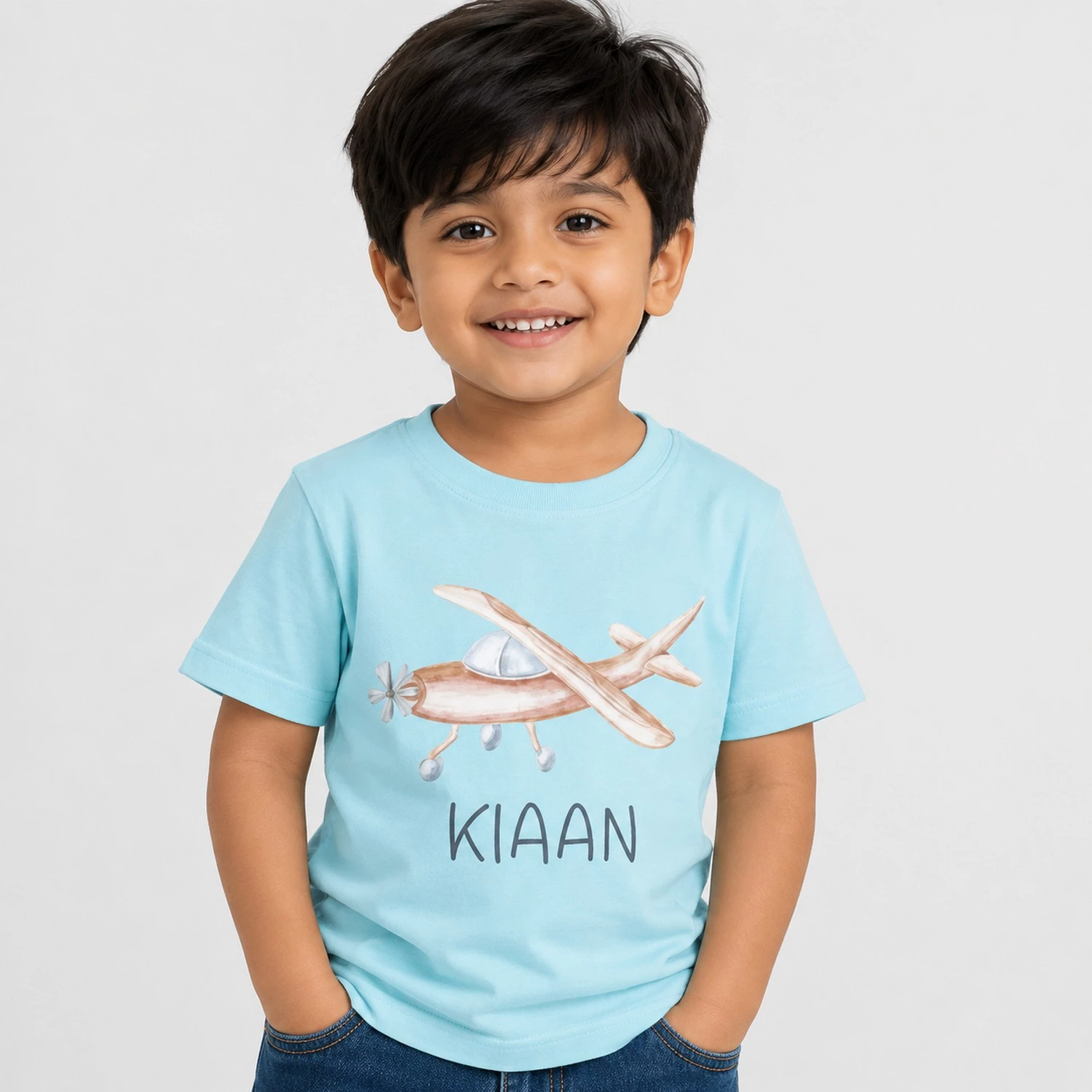 Personalised sky blue boys T-shirt with Kiaan name and cute airplane design
