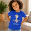 Personalised blue girls T-shirt with Aisha name and cute floral giraffe design