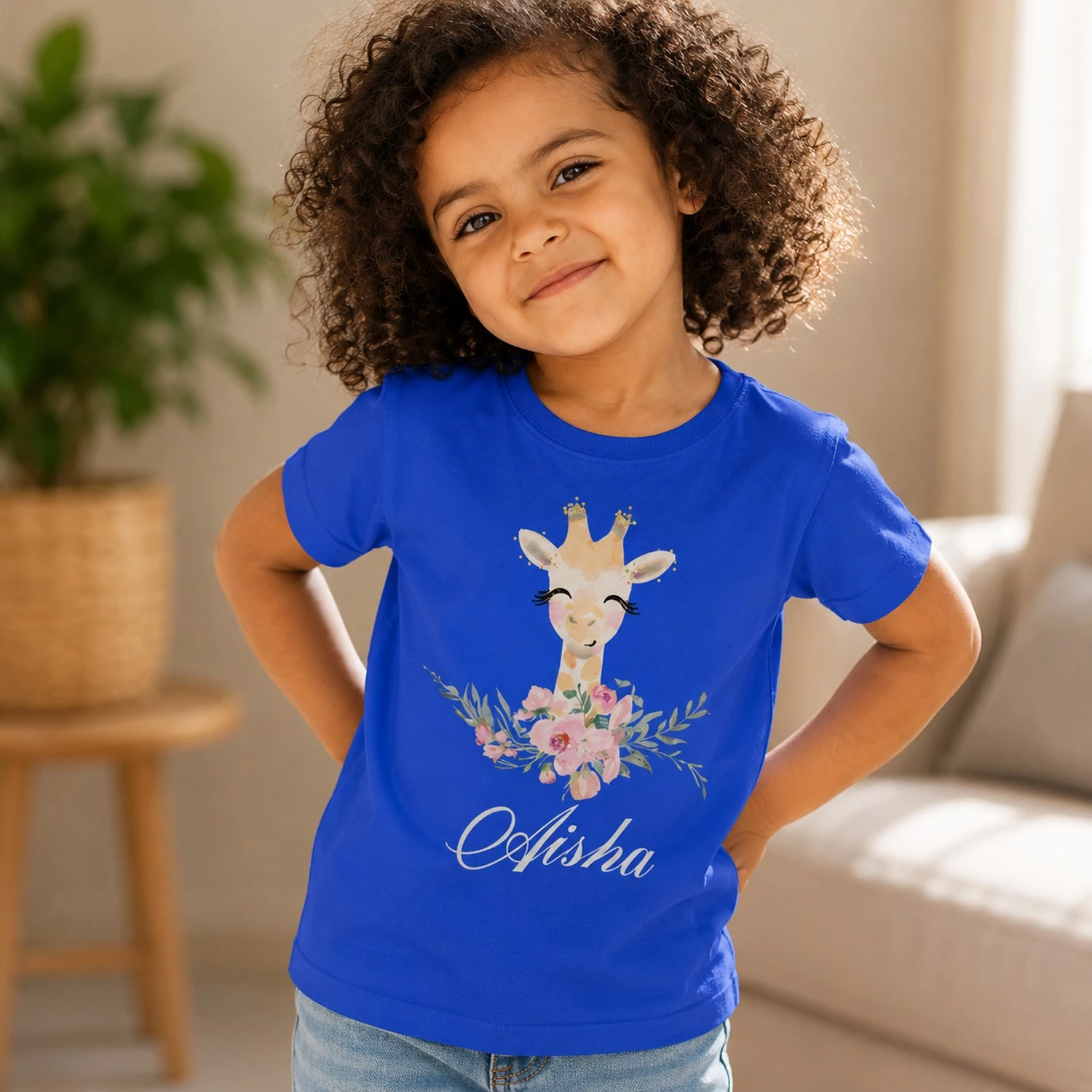 Personalised blue girls T-shirt with Aisha name and cute floral giraffe design