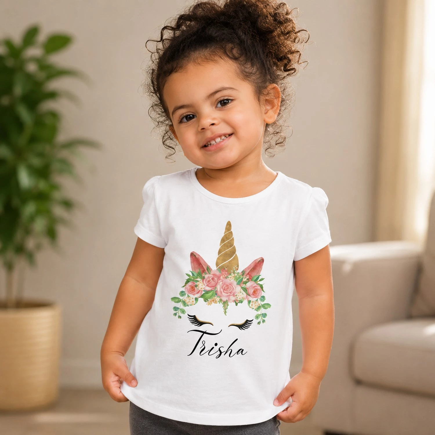 Personalised white girls T-shirt with Trisha name and floral unicorn design