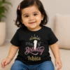 Personalised black first birthday T-shirt for baby girl with crown, number 1 and custom name Ishita