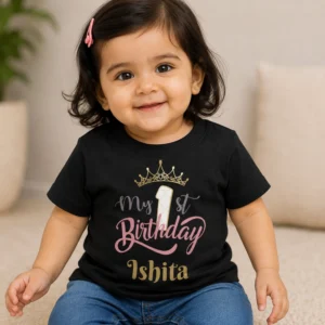 Personalised black first birthday T-shirt for baby girl with crown, number 1 and custom name Ishita